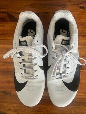 Nike women’s  light blue track Shoes with Black Swoosh
